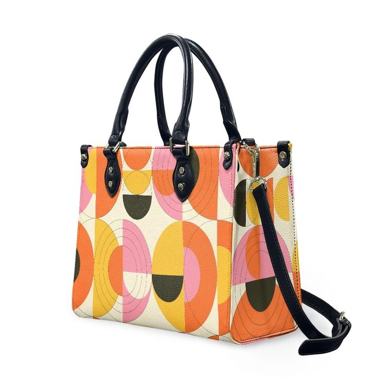 • Elevate your style with our retro style 60s Space Age Opt Art Handbag, a chic fusion of mod and vintage aesthetics inspired by the iconic designs of the 60s.• This Mod 60s Handbag features a mesmerizing geometric opt art pattern print in vibrant shades of orange, pink, yellow, and black, adding a bold and artistic touch to any outfit.• Crafted from premium PU leather, this Retro Handbag Women boasts an exquisite zipper closure and comes with a removable strap for added versatility.• Available in three sizes - small, medium, and large - and with two handle options in black and white, this 60s Style Handbag offers both style and practicality for every occasion.**Designed in California by Trendy Hip Buys. Made to order from overseas. Vintage Satchel With Detachable Strap For On-the-go, Vintage Rectangular Satchel For On-the-go, Retro Rectangular Box Bag For Everyday Use, Retro Box Shoulder Bag With Removable Pouch, Retro Shoulder Box Bag With Removable Pouch, Retro Crossbody Box Bag For Travel, Retro Travel Crossbody Box Bag, Retro Box Bag With Removable Pouch, Retro Travel Box Bag With Removable Pouch