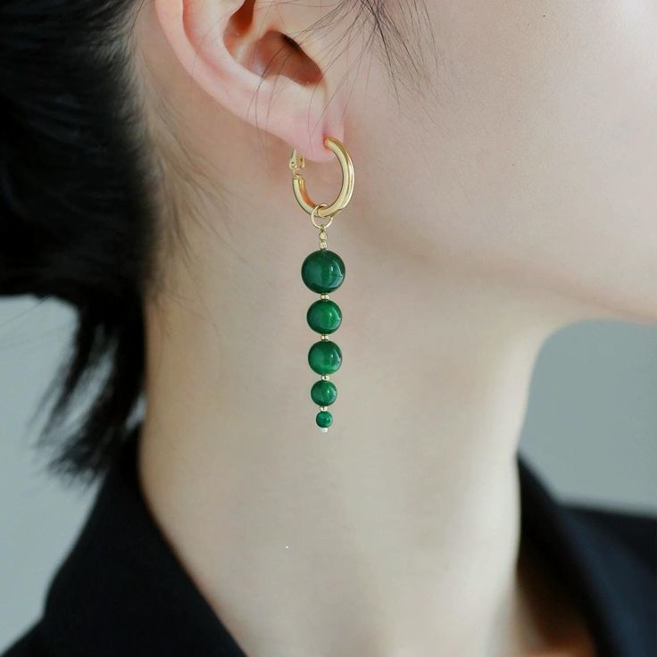 MATERIAL:  ※ Bead, Pleating Gold, Brass FEATURES:  ※ These stunning emerald green earrings feature a vibrant green hues that catch the light beautifully. Each earring showcases five graduated beads, creating a dynamic and eye-catching design. Elevate your accessory game with this unique and playful piece that adds a pop of color to any outfit! Emerald Green Earrings, Green Hues, Green Beads, Green Earrings, Gold Brass, Vibrant Green, Green Bead, Emerald Green, Beaded Earrings