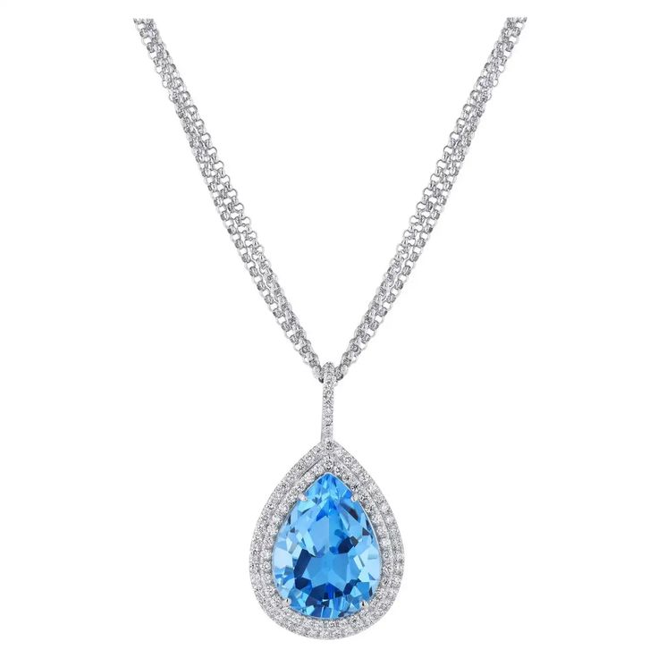 For Sale on 1stDibs - Handmade Pear Shaped Blue Topaz Diamond Drop Pendant. This beautiful pendant features a 17.74 carat pear shaped blue topaz. There is an additional 122 Luxury Pear-shaped Blue Topaz Jewelry, Luxury Blue Pear-shaped Necklace, Blue Topaz Teardrop Necklace For Formal Occasions, Formal Blue Topaz Teardrop Necklace, Formal Teardrop Blue Topaz Necklace, Blue Topaz Pear-shaped Necklace, Blue Pear-shaped Diamond Necklace, Blue Pear-shaped Blue Topaz Necklace, Pear-shaped Blue Brilliant Cut Jewelry