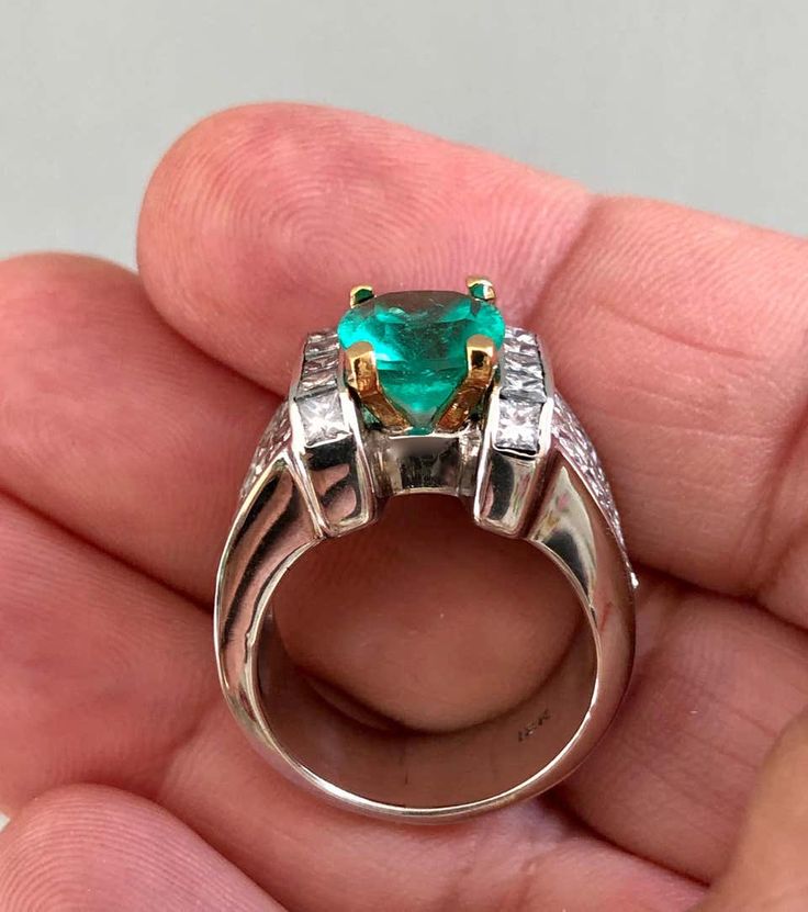 For Sale on 1stDibs - A classic, Cocktail estate. ring holding a Fine Natural Colombian Emerald and Diamonds, crafted in 18K Gold/ Unisex Primary Stone: Fine Natural Colombian Luxury Trillion Cut Emerald Ring For Formal Occasions, Trillion Cut Emerald Ring For Formal Occasions, Gia Certified Trillion Cut Formal Rings, Formal Gia Certified Trillion Cut Ring, Luxury Gia-certified Trillion Cut Emerald Ring, Luxury Gia Certified Trillion Cut Emerald Ring, Luxury Trillion Cut Rings For Anniversary, Luxury Trillion Cut Anniversary Ring, Luxury Open Emerald Ring For Formal Occasions