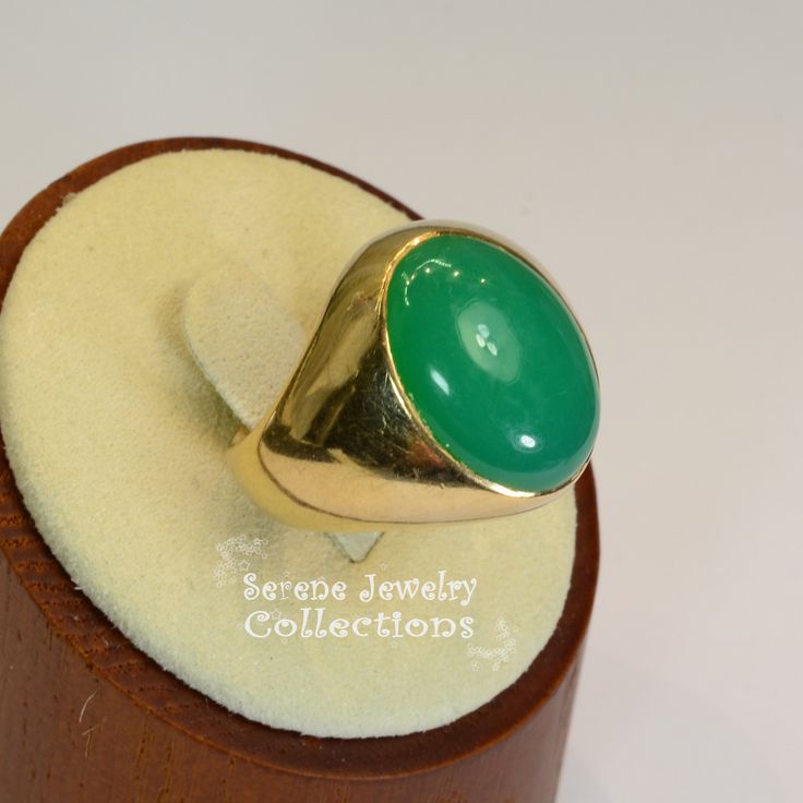 A beautiful simple Chrysoprase cabochon is the centerpiece of this 14k gold ring. It is rare to find chrysoprase in such fine green and even color tone! Ring Size: 9.5 Total Weight: 11.5 grams Precious Metal: 14k Yellow Gold Precious stones: -Chrysoprase Center Stone: 12.2 carats, 18.6mm x 13.3mm Hallmark: 14k Green Cabochon Emerald Ring Fine Jewelry, Fine Jewelry Green Emerald Cabochon Ring, Fine Jewelry Green Cabochon Emerald Ring, Fine Jewelry Emerald Green Oval Cabochon Ring, Green Oval Cabochon Emerald Ring, Yellow Gold Emerald Chrysoprase Cabochon Ring, Classic Oval Chrysoprase Ring, Elegant Green Opal Ring With Oval Cabochon, Elegant Green Opal Ring Oval Cabochon