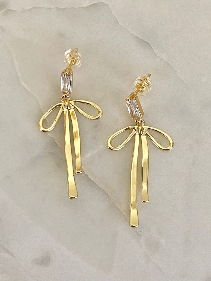 For all the bow lovers🎀 Material: 16k gold plated on brass 14k Gold Bow Jewelry, Gold 14k Party Earrings, 14k Gold Earrings For Party, Chic Metal Jewelry With Bow Detail, Gold Earrings With Decorative Bow As Gift, Gold Earrings With Decorative Bow For Formal Occasions, Formal Gold Earrings With Decorative Bow, Elegant Gold Jewelry With Butterfly Knot, Elegant Gold Jewelry With Ribbon