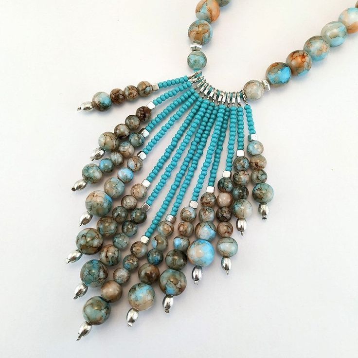 ❤Before completing your purchase, please, read carefully about delivery times for your country and keep in mind that delivery delays may happen due to the pandemic situation and the consequent decrease in the number of flights worldwide. So pretty and stylish jewelry! A delicate long boho necklace beaded with high-quality glass beads, crystals beads, metal beads, and blue tassel embroidered with crystals. It's perfect to compose any look, basic or classic, you can wear it any time. ❤IMPORTANT TO Adjustable Turquoise Tassel Necklace With Round Beads, Bohemian Tassel Necklace With Beaded Chain, Bohemian Turquoise Necklace With Dangling Beads, Turquoise Bohemian Tassel Necklace, Turquoise Beaded Tassel Necklace With Round Beads, Handmade Turquoise Tassel Necklace Bohemian Style, Turquoise Beaded Tassel Necklace Gift, Turquoise Beaded Long Necklace With Dangling Beads, Turquoise Beaded Tassel Necklace