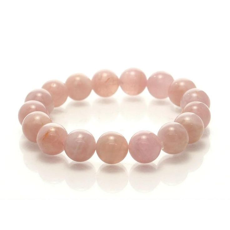 Madagascar Rose Quartz Stretch Bracelet 12mm Size Approx. 6 3/4" Rose Quartz is the pink variety of Quartz. Its colors range from a pastel pink to a rose pink hue, including orange and violet pink tones, which are believed to be caused by trace amounts of aluminum, phosphorous and manganese. While Rose Quartz can often be very opaque with just a hint of pink, Madagascar Rose Quartz is noted for its fine translucency (soft radiating inner glow); beautiful classic ‘rose’ hues with an almost lumine Pink Rose Quartz Round Stretch Bracelet, Pink Rose Quartz Stretch Bracelet, Pink Rose Quartz Stretch Bracelet With 8mm Beads, Elegant Pink Bracelets With 8mm Beads, Pink Rose Quartz Round Beaded Bracelets, Pink Rose Quartz Round Bracelet, Pink Bracelets With 8mm Round Beads, Orange And Violet, Inner Glow