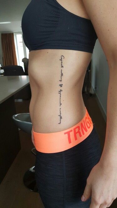 a woman with an orange band around her waist and the word truth on her stomach