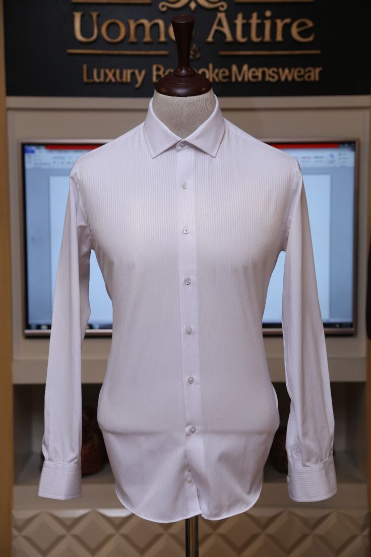 Description White colour vertical texurted line shirt. Elegant Business Tops With Vertical Stripes, Elegant White Tops With Vertical Stripes, Elegant Tops With Vertical Stripes For Business, Pinstripe Button-up Business Tops, Fitted Vertical Stripes Business Shirt, Classic Fitted Pinstripe Tops, White Business Top With Vertical Stripes, Classic Button-up Tops With Vertical Stripes, White Vertical Stripes Business Top