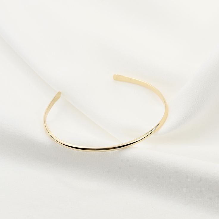 "14K gold cuff bracelet. 14K Gold Minimalist Cuff Bracelet, Delicate cuff bracelet. The bracelet will be shipped in a gift box * 14K solid gold. It is about 2.5mm width. Please select the size of your wrist. If your wrist is 6\", please purchase a 6\" bracelet. (If you order a 6\" bracelet, actual cuff length will be 5\" plus 1 inch opening.) Please read our policies before you place your order. https://www.etsy.com/shop/SashJewelry/policy?ref=shopinfo_policies_leftnav To see other Mother daught Other Mother, Gold Cuff Bracelet, Mother Daughter Necklace, Solid Gold Bracelet, Bracelet Minimalist, Daughter Necklace, Gold Bracelet Cuff, Toggle Bracelet, Gold Cuffs