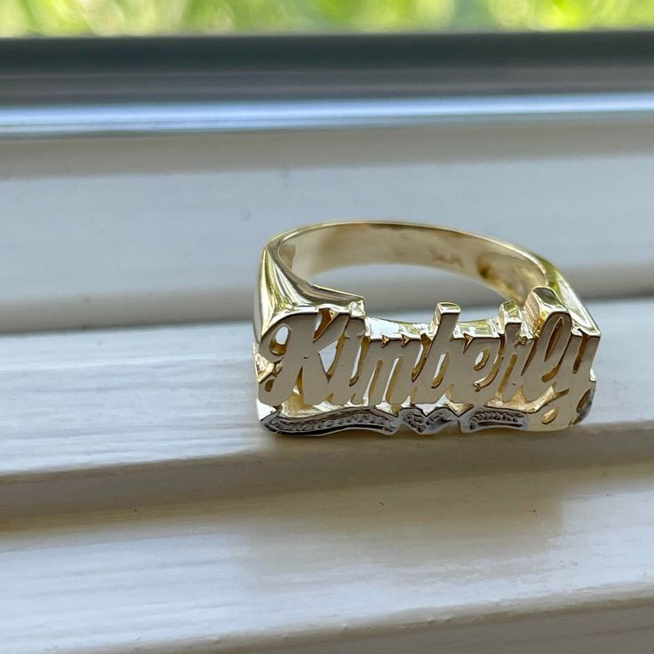 Medium Size Personalized Name Ring In Real 10K & 14K Gold *FLAT FACE * MADE IN USA (HAND MADE ITEM) Make the names of your family, friends and love ones into rings for their gift. It's great as an everyday necklace and makes an awesome gift! This Item is 100% customization especially for you. Item Description *Material: Real Gold *Type: *FLAT FACE* ( Like photo) with Heart Tail with Bit Work *Ring size: ring sizes between 1-11 (including half sizes) *Size of Ring : 20mm*8mm *Script Design *O Personalized Nameplate Ring For Promise, Personalized 14k Yellow Gold Diamond Ring, Personalized Engraved 14k Gold Ring, Personalized Engraved Nameplate Ring For Promise, Custom Name Plate Ring For Promise, 14k Gold Initial Ring For Promise With Custom Name, Promise Ring With Custom Name In 14k Gold, Promise Ring With Custom Nameplate, Custom Name Initial Ring In 14k Gold And Silver