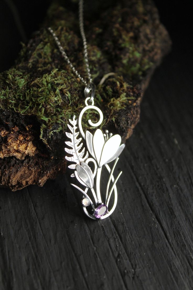 ITEM DESCRIPTION: The size H 5 cm x W 3 cm (2 x 1 inch). Weight - 4 g. You can buy it with a silver chain or without it. I made this unique Crocus pendant of sterling silver, dark amethyst, and moonstone. This is similar to the first spring flowers that appear from under the snow. The floral necklace looks so gentle and elegant! This handmade necklace will come to you in a gift box - ready for gifting. The parcel will be sent 1-2 days after payment. Delivery usually takes 10-21 days. But in the Spring Flower-shaped Jewelry Gift, Birth Flower Jewelry For Spring, Nature-inspired Flower Pendant Jewelry For Mother's Day, Mother's Day Nature-inspired Pendant Necklace, Unique Flower-shaped Jewelry With Flower Charm, Spring Birth Flower Jewelry, Spring Sterling Silver Jewelry With Flower Charm, Silver Necklace With Flower Charm For Spring, Silver Necklaces With Flower Charm For Spring