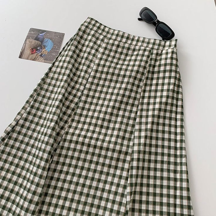 Midi length skirt with an elastic back. Hugs your hips and flares at the hem. Lined. 23.5"-31.5" waist, 37" hips, 28" length Back Hugs, Midi Skirt Green, Plaid Midi Skirt, Midi Length Skirts, Shoe Gifts, Overall Dress, Green Skirt, Sweater Blouse, Cardigan Jacket