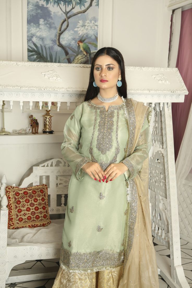 ➤ Mint green embroidered masuri organza kameez, golden jamawar Gharara, golden masuri organza dupatta | Length – Shirt Length 38"; Sharara Length 39.5" with Soft Elastic Belt; Dupatta length 2.18 m Width With Lace 0.89 m & Without Lace 0.85 m ➤ ➤ ➤ ➤ 🌸 Fabric Details - Chiffon, Organza, 🌸 Craft and Decorations - Beautiful Embroideries, embellishments, patches, and laces 🌸 Care - Hand Wash only 🌸 Length & Style - Top ~ 38 - 40 " A-Line/ kurta style, bottom trousers/gharara style, with embroid Jamawar Gharara, Organza Kameez, Party Wear Suits, Suits Pakistani, Indian Dresses For Women, Kurta Style, A Line Kurta, Elastic Belt, Organza Dupatta