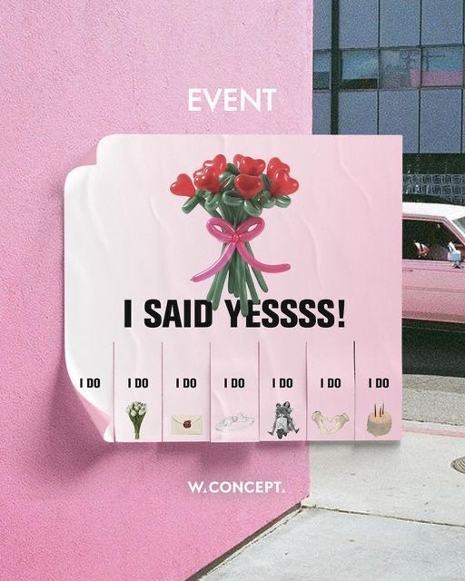 a pink sign that says i said yess on the side of a building with flowers in it