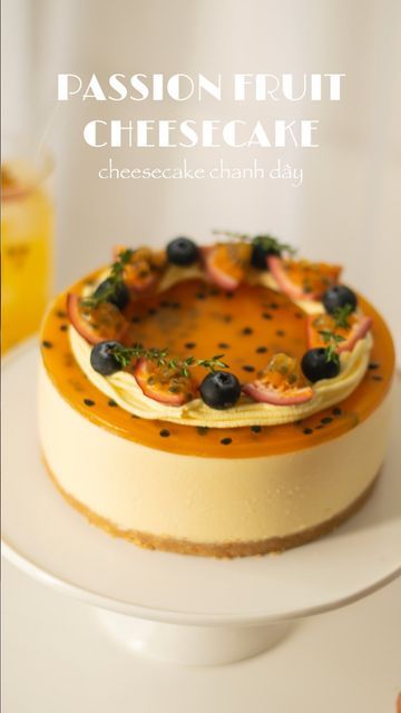 a cheesecake topped with blueberries and other toppings on top of a white plate