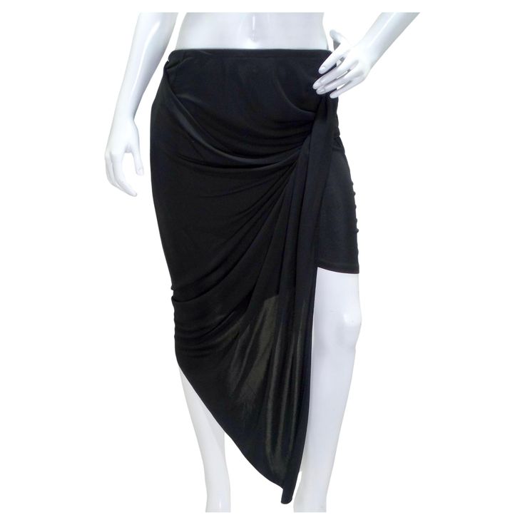 Step into the epitome of contemporary elegance with the Mugler Black Draped Skirt, a mesmerizing piece that effortlessly combines modernity and versatility. Crafted from stretch-jersey, this midi skirt is a masterclass in design, featuring meticulous gathering and draping to create a stunning asymmetric silhouette. The dynamic design not only showcases the craftsmanship but also accentuates your curves in a tasteful and flattering manner. The stretch-jersey fabric ensures comfort without compromising style, allowing for easy movement while maintaining a sleek look. The asymmetric hem adds a touch of drama and flair, making it a statement piece for any occasion. This skirt seamlessly transitions from day to night, offering a contemporary and versatile addition to your wardrobe. Embrace the Ethereal Dramatic, Mugler Black, Gonna Midi, Gucci Boots, Black Drapes, Draped Skirt, Dynamic Design, Asymmetrical Skirt, Sleek Look