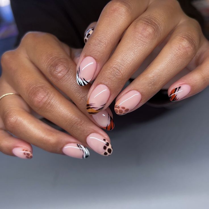 Animal print frenchies 🦓 On a short almond with all neutral tones 🤎 #nailart #naturalnails #naturallongnails #gelnails #bayareanails #groovynails #nailinspo Animal Print Tip Nails, Short Almond Cheetah Nails, Zebra Nail Art Designs, Animal Print French Nails, Short Animal Print Nails, Short Leopard Print Nails, Safari Themed Nails, Safari Theme Nails, Animal Print French Tip Nails