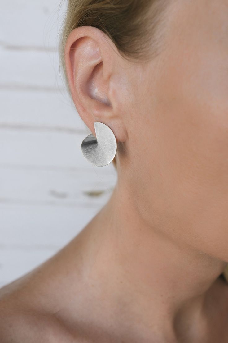 Round silver earrings, Sterling Silver Big Stud Earrings, Modernist Silver Earrings Sterling Silver Minimalist Earrings Nickel Free earrings Size S Earrings are also available in brass. Other sizes of the same model you can see by clicking on https://www.etsy.com/shop/MairBerlin?ref=seller-platform-mcnav&section_id=25830317 These round earrings made out of solid silver are polished to give them a soft matte texture. Their simple bend behind the ear turns them into a pair of elegant and lightweig Simple Silver Earrings, Big Stud Earrings, Minimalist Necklace Gold, Silver Statement Earrings, Layered Necklace Set, Round Pendant Necklace, Nickel Free Earrings, Gold Necklace Set, Free Earrings