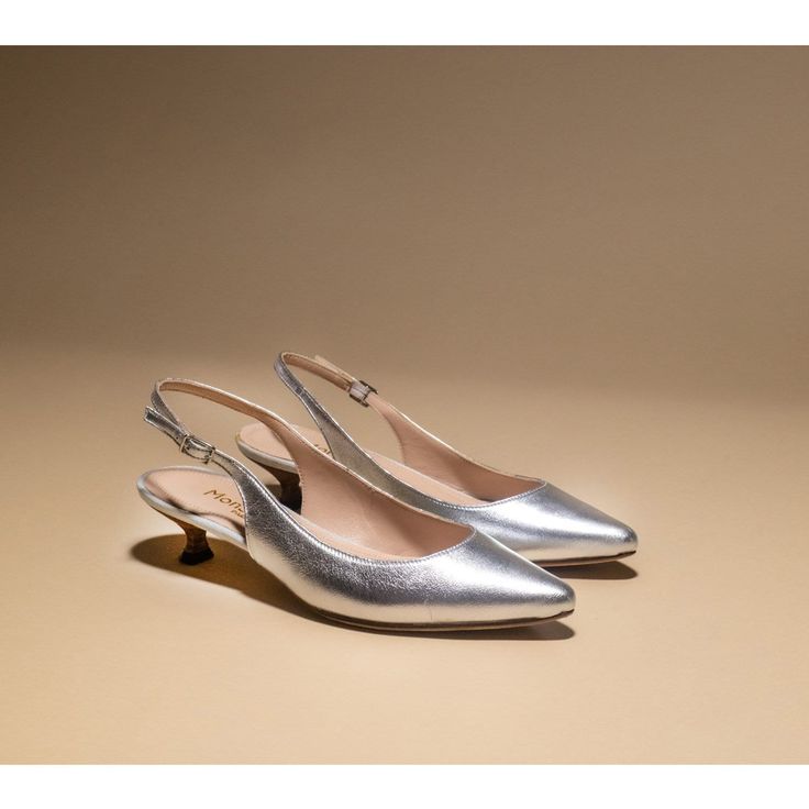 Kitten heel pointy slingback in silver leather  3 cm heel  Leather sole  Leather lining  Italian size Our new addition of pumps with the 3 cm kitten heel Alice slingback Discover our low heels and flats:  https://www.etsy.com/shop/MonSoulier?section_id=18031442 Metallic Silver Leather Heels With Pointed Toe, Silver Leather Kitten Heels With Sculpted Heel, Silver Leather Slingback Pumps For Evening, Silver Leather Slingback Pumps For Party, Silver Almond Toe Heels With Sculpted Heel, Chic Silver Kitten Heels For Formal Occasions, Silver Pointed Toe Slingback Pumps With Sculpted Heel, Silver Slingback Pumps With Sculpted Heel And Pointed Toe, Silver Leather Pointed Toe Slingback Pumps