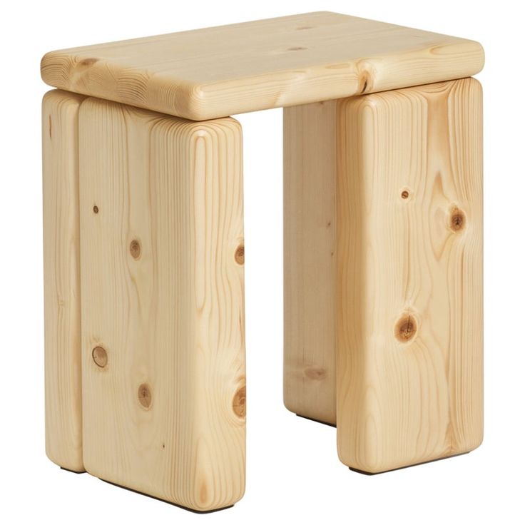 a small wooden stool sitting on top of a white floor