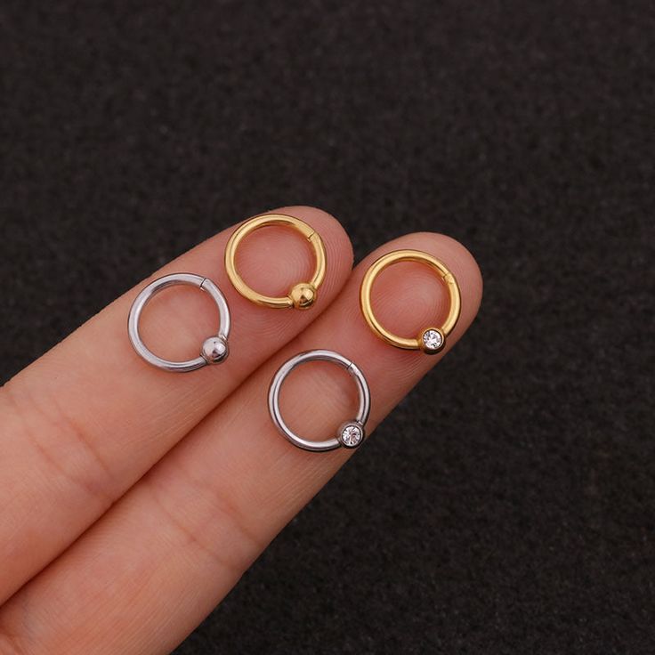 Buying Option: - $14.99 for Single Piece- $19.99 for a Pair (you can choose 2 different earrings)*Comment your option of patterns and color on "Personalization"----------- DESCRIPTIONS ------------ Color: Silver/ Gold - Patterns: Smooth Hoop/ CZ Hoop- Gauge: 16G - 1.2mm- Diameter: 8mm- Stainless Steel Ball: 4mm- Materials: 316L Stainless Steel, 18K Gold Plated, Cubic Zirconia- SKU: HSPJ227- 316L Stainless Steel is hypoallergenic, generally safe for sensitive skin.----------- MIX MATCH PURCHASE - Round Internally Threaded Cartilage Earrings, Internally Threaded Round Cartilage Earrings, Trendy Round Metal Cartilage Earrings, Single Round Metal Cartilage Earring, Trendy Single Round Cartilage Earring, Minimalist Metal Septum Ring Internally Threaded, Minimalist Internally Threaded Metal Septum Ring, Trendy Metal Hoop Piercings, Minimalist Metal Huggie Cartilage Earrings