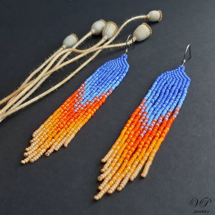 Colorful long seed beaded earrings, boho beaded earrings, shoulder dusters Summer Orange Beaded Earrings With Tiny Beads, Bohemian Orange Fringe Earrings, Adjustable Orange Tiny Beads Earrings, Orange Dangling Beads For Jewelry Making, Orange Fringe Earrings As A Gift, Orange Fringe Earrings As Gift, Handmade Orange Beaded Earrings For Summer, Orange Fringe Tassel Earrings For Gift, Bohemian Orange Tassel Earrings