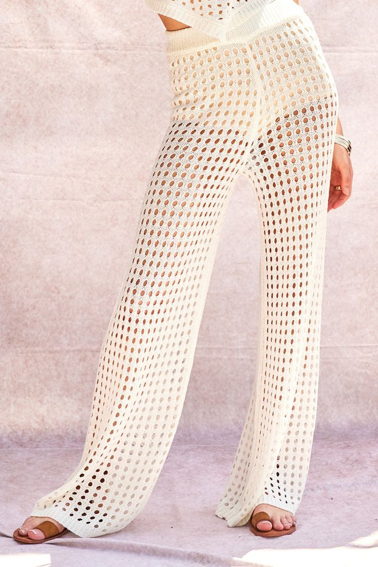 These Sarah crochet pants adds a touch of playful charm to your wardrobe with their sheer crochet design and wide leg style. The elastic waistband provides comfort and versatility, while the unlined feature allows for a lightweight and breezy feel. Don't forget to pair it with the matching top for a complete look! Crochet Waistband, Crochet Pants, Swimwear Store, Night Dresses, Crochet Design, One Piece Swim, Matching Top, Scarf Hairstyles, Crochet Ideas