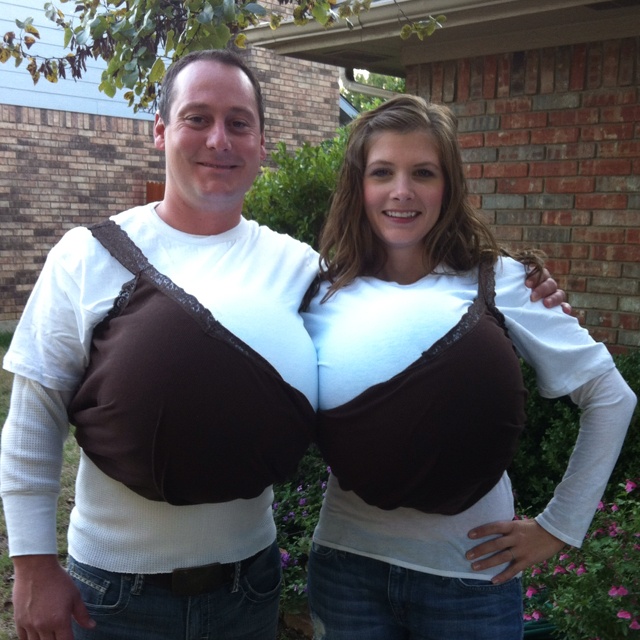 a man and woman dressed in costumes standing next to each other