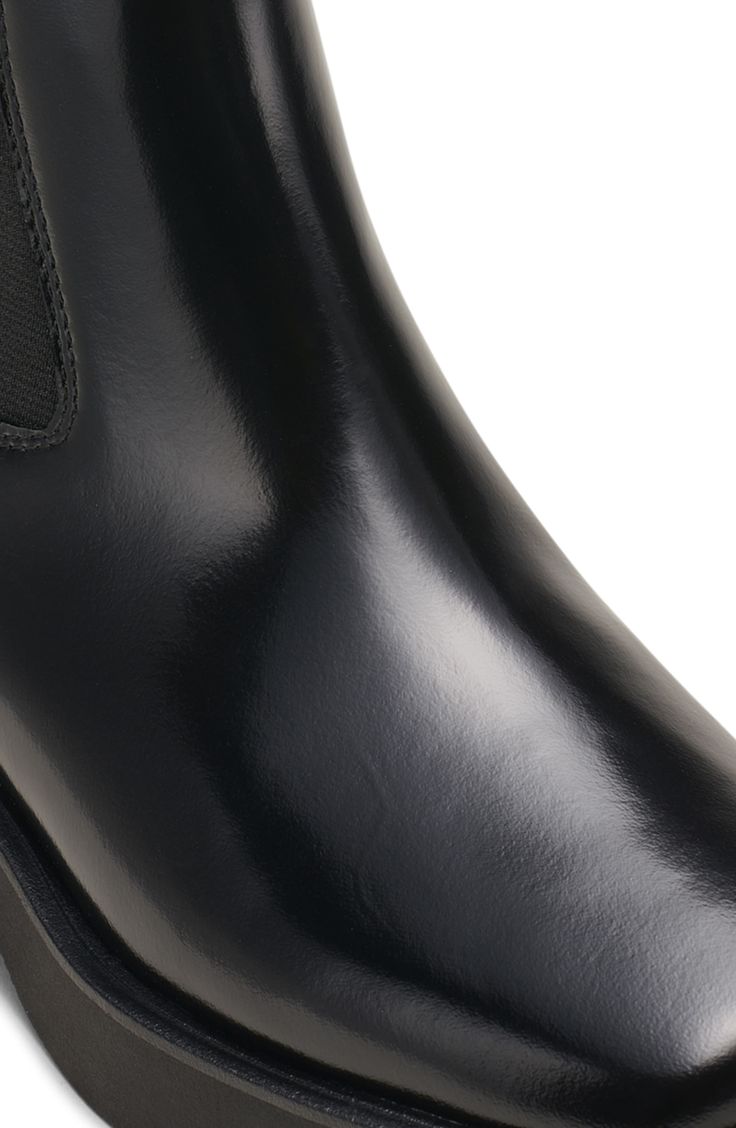 A square toe modernizes the silhouette of this leather Chelsea boot designed to keep you in style in every season. 1 1/2" heel 7" heel Cushioned footbed with arch support Leather and textile upper/leather lining/synthetic sole Imported Modern Almond Toe Chelsea Boots For Work, Classic Chelsea Boots With Square Toe In Calf Leather, Classic Square Toe Chelsea Boots In Calf Leather, Square Toe Chelsea Boots In Calf Leather For Work, Square Toe Calf Leather Chelsea Boots For Work, Classic Heeled Boots For Work With Heel Pull Tab, Square Toe Chelsea Boots With Reinforced Heel For Work, Workwear Chelsea Boots With Calf Leather And Leather Lining, Classic Heeled Boots With Reinforced Heel And Square Toe