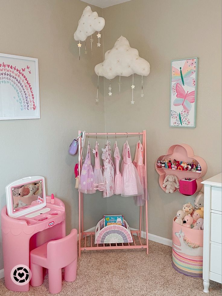 a child's bedroom with pink furniture and accessories on display in the corner,