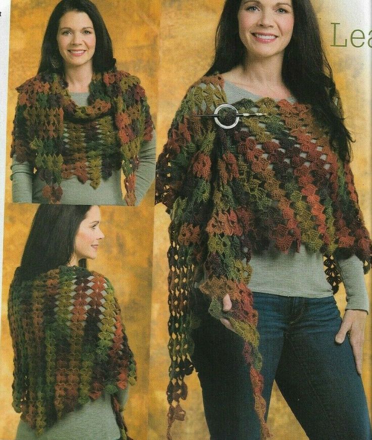 a woman is wearing a crocheted shawl and smiling