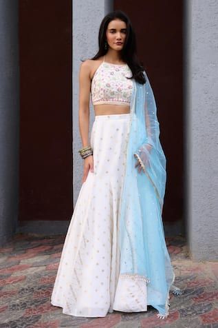 Ivory gusset lehenga with woven floral motifs. Paired with multicolour thread embroidered blouse and contrast powder blue dupatta. - Aza Fashions Off White Chanderi Lehenga For Designer Wear, Designer Off White Chanderi Lehenga, Unstitched Off White Lehenga For Eid, White Chanderi Lehenga For Reception, Designer White Fitted Lehenga, White Wedding Sets With Dori Work, White Chanderi Choli With Dori Work, White Dori Work Designer Sets, Unstitched White Choli With Sheer Dupatta