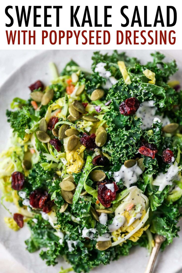 kale salad with poppy seed dressing on a white plate