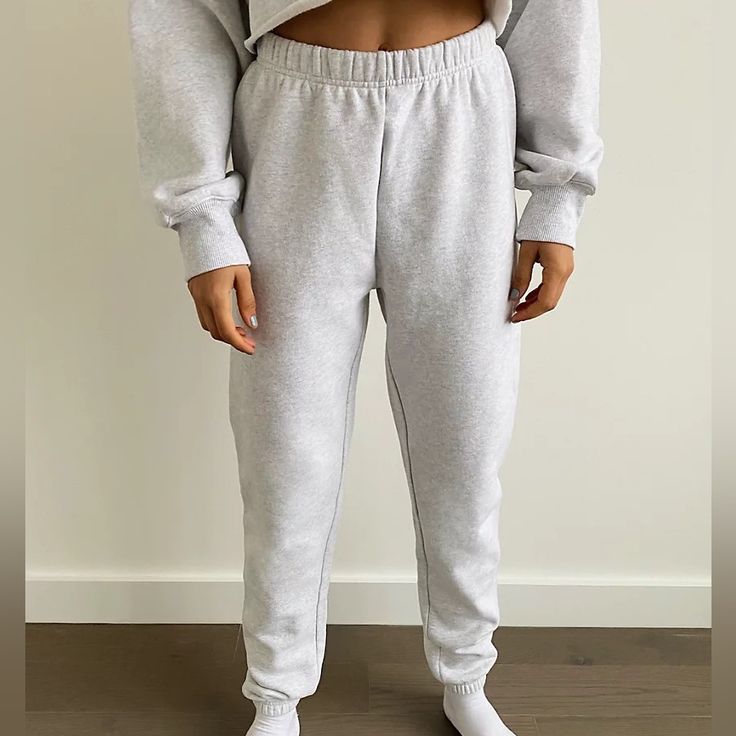 These Are High-Rise Sweatpants With A Slim Leg And Elastic Cuffs. They're Made With Tna’s Cozy Fleece Premium, Midweight Fleece With A Soft-Brushed Back, Sueded Face And Cloud-Nine Cozy Feel. They've Been Recently Redesigned For An Even More Flattering Fit. Cozy Leisure Sweats, Basic Fall Loungewear Pants, Cozy Sweatpants With Ribbed Waistband, Basic Bottoms With Ribbed Cuffs, Cozy Long Joggers For Fall, Cozy Full-length Winter Sweatpants, Winter Full Length Sweatpants For Leisure, Full Length Winter Sweatpants For Leisure, Full-length Sweatpants For Winter