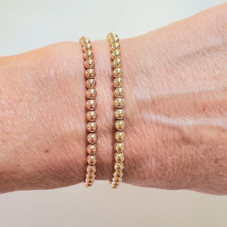 **Get Lower Prices On Our Website!! - Bochellijewelry.Com - (Not On Here On Our Own Website) ***This Is A Handmade Item And Is Stamped 14k On The Clasp*** This Listing Is For One Solid 14k 4mm Gold Bead Stretchy Bracelet 14k Solid Yellow Or Rose Gold 4mm Round Beads (2-12mm Also Avail C Shop) - White Gold Is Not Available. Clear Stretchy Cord (Search Our Shop For 4mm Listings With Clasps) Measure Your Wrist Wrist Wrist Before Ordering. Do Not Measure Your Chain Or Bead Bracelet. Follow The Instr 14k Gold-filled Yellow Gold Jubilee Beaded Bracelets, 14k Gold Yellow Rondelle Beaded Bracelets, Classic Gold Bracelets With Tiny Beads, Classic Yellow Gold Rondelle Beaded Bracelets, 14k Yellow Gold Rondelle Bracelets, Everyday Yellow Gold Bracelet With 8mm Beads, Classic 14k Yellow Gold Beaded Bracelets, Classic Gold Beaded Bracelets With Tiny Beads, Classic Gold Beaded Bracelet With Tiny Beads