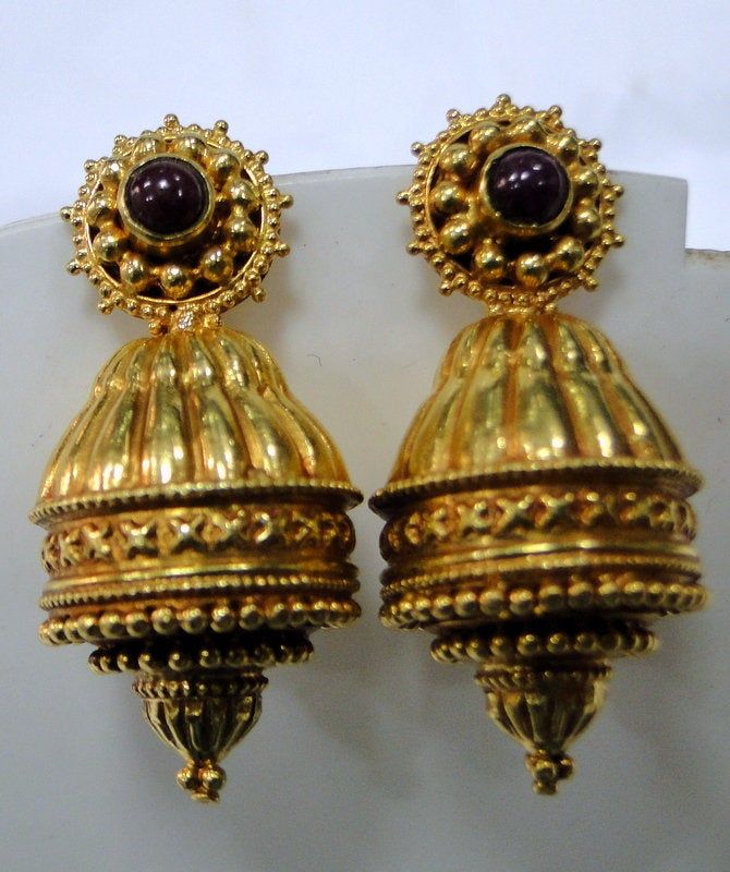 Vintage 22 k solid gold Ruby gemstone set earrings. full handmade collection pair in very good condition. Length-3.7 cm, weight of pair-14 grams, material -22 K gold and Rubies gemstones. pendant strung together with south sea pearls and gold beads. Beautiful one of type piece in very good condition. Luxury Traditional Yellow Gold Danglers, Antique 22k Yellow Gold Earrings, Antique Gold Earrings For Festivals, Antique Gold Earrings With Latkans, Heavy Gold Traditional Danglers, Traditional Heavy Gold Danglers, Ceremonial Heavy Gold Danglers, Festival Gold Brass Jhumkas, Traditional Gold Brass Danglers