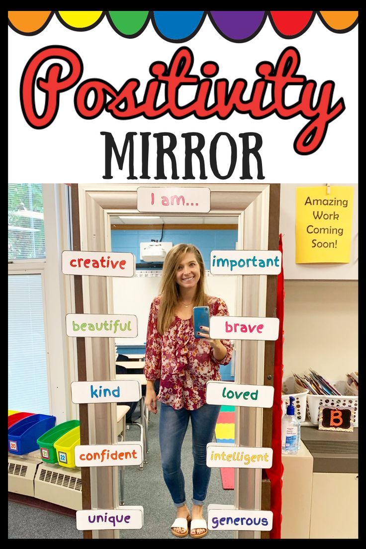 a woman standing in front of a door with words on it and the word'positivity mirror'above her