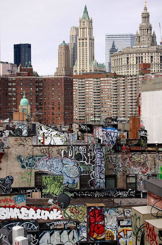 the city skyline is covered in graffiti and buildings