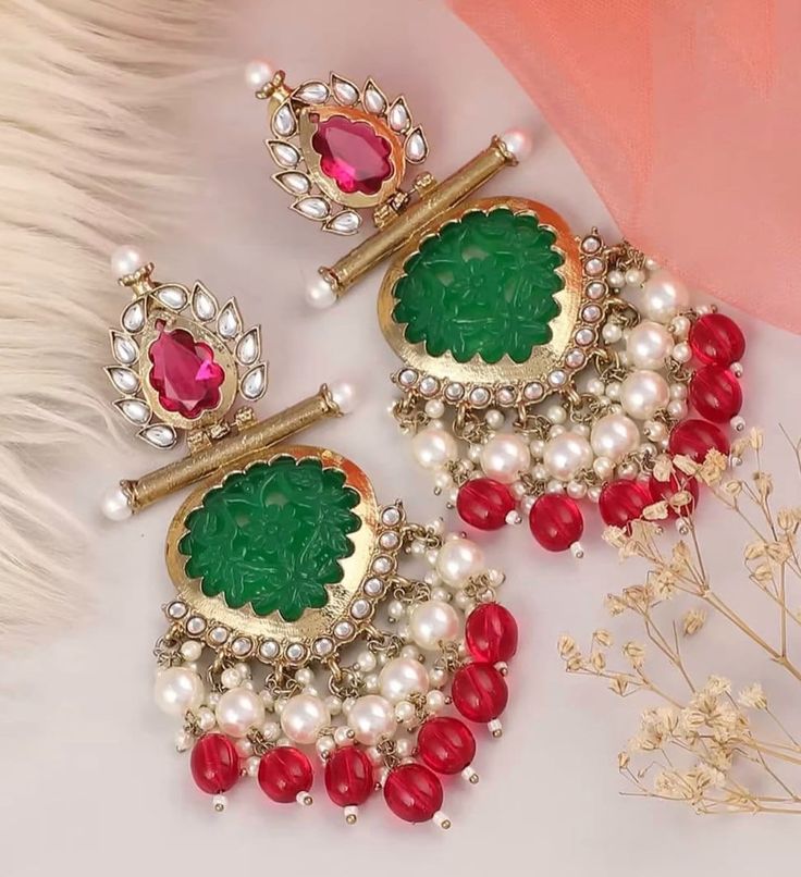 Beautiful dangler earrings with Kundan gold detailing available in 10 stunning colours! They add elegance to every outfit! Luxury Green Hand-set Chandbalis, Luxury Chandbali Jewelry For Parties, Luxury Kundan Chandelier Earrings For Wedding, Luxury Green Kundan Danglers, Luxury Kundan Dangle Danglers, Festival Kundan Temple Jewelry Earrings, Kundan Temple Jewelry Earrings For Festivals, Temple Jewelry Kundan Earrings For Festivals, Fusion Pearl Earrings With Meenakari For Celebrations