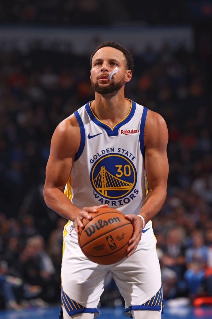 a man holding a basketball in his right hand