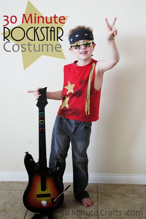 a young boy standing in front of a guitar with the words 30 minute rock star costume