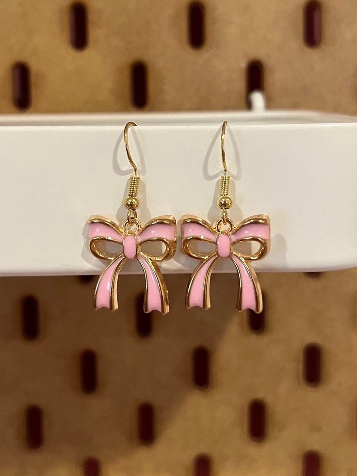 Dangly enamel earrings of pink ribbon bows Ribbon Earrings, Crochet Baby Clothes, Enamel Earrings, Pink Ribbon, Ribbon Bows, Crochet Baby, Jewelry Earrings Dangle, Mood Board, Etsy Earrings