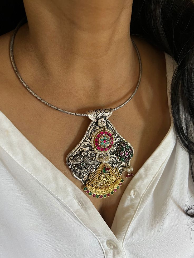 RESTOCKED ♥️ An heirloom antique pure 925 silver necklace! For all silver jewelry lovers, Shivka showcases traditional treasures with unmatched craftsmanship. The elegant Hasli necklace is Purely handmade with love by our skilled Indian craftsmen from Jaipur in real silver with antique polish and semi-precious stones. Comes with a hook closure. Metal Purity: Hallmarked 925 Silver The height of the pendant is 3 inches. The width of the pendant is 3 inches  Weight of the hasli and pendant: 77 gram Pendant Temple Necklace With Filigree As A Gift, Pendant Temple Necklace With Filigree For Gifts, Silver Dual-tone Round Necklace, Ornate Silver Bridal Necklace, Dual-tone Silver Temple Necklace For Festive Occasions, Silver Dual-tone Jewelry For Celebration, Festive Dual-tone Silver Temple Necklace, Elegant Dual-tone Pendant Jewelry, Silver Dual-tone Kundan Necklace Temple Jewelry