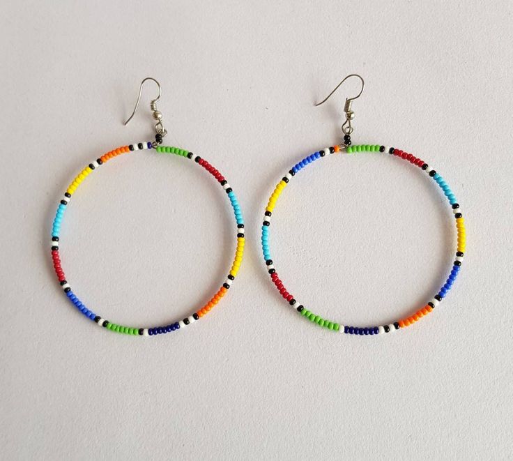 A set of 5 beaded hoop earrings , earrings for women, large hoop earrings, colorful earrings. Listing is for ALL 5 earrings. They make a perfect gift. The earrings measure 3 inches from top of the hook. **Buy multiple items and pay shipping for 1 item only.The rest ships free. Thank you for visiting. Native American Inspired Earrings, American Clay, Diamond Shape Earrings, Wholesale Earrings, Beaded Jewelry Necklaces, Pulseras Diy, Earrings Colorful, Beaded Pendant Necklace, Beaded Bracelet Patterns