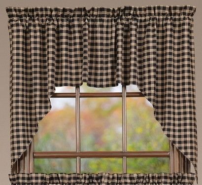 a window with a black and white checkered curtain