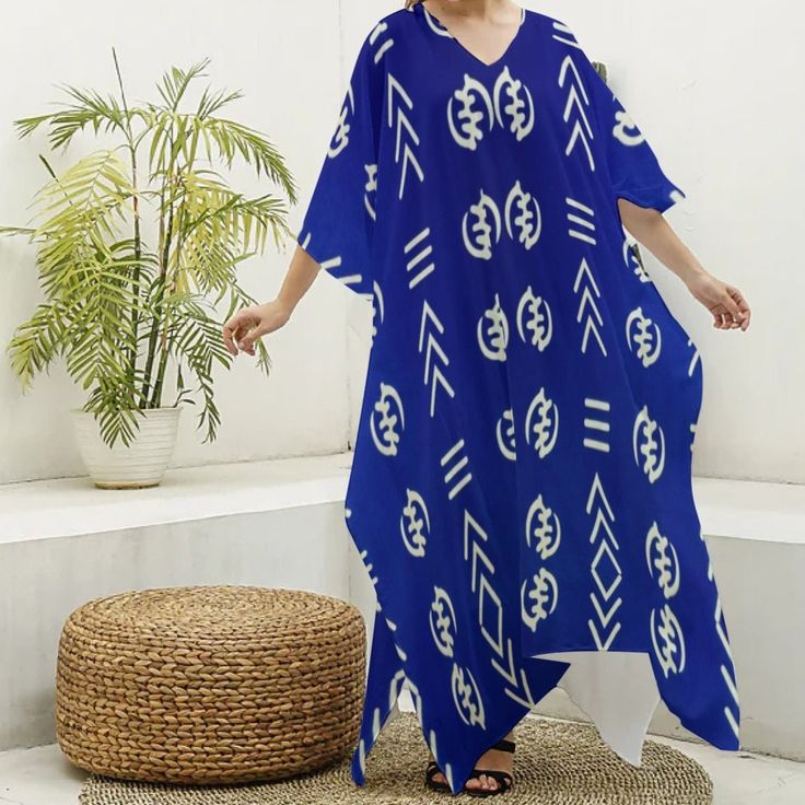 Stay cool and stylish with our Adinkra Print Women's Imitation Silk V-neck Kaftan Robe. Capture your memories in comfort and style with this must-have travel essential. Fabric: Imitation Silk(97% polyester and 3% spandex) Regular fit V-neck Fabric weight: 90g/m² Care Instruction: machine wash cold with similar colors, do not bleach, tumble dry low, do not iron, do not dry clean. Blue Gye Nyame V-neck Kaftan Robe, African Print Dress, Ankara Kaftan, African Print Muumuu, African Print Cover Up White Printed V-neck Kaftan, V-neck Kaftan For Vacation, V-neck Batik Print Beach Dress, Bohemian V-neck Printed Kaftan, Blue Printed V-neck Beach Dress, Printed V-neck Free Size Kaftan, Casual Printed V-neck Kaftan, Blue V-neck Free Size Maxi Dress, Printed V-neck Kaftan For Vacation