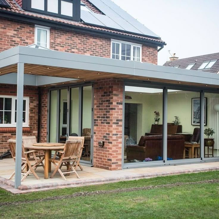 a house with a covered patio and dining area