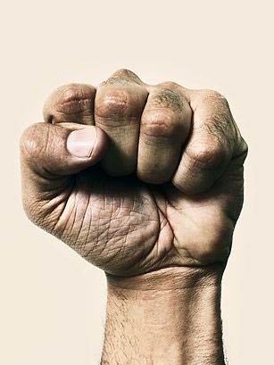 an old man's fist is shown in this image