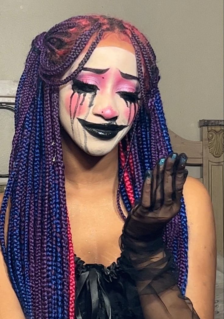 Clown core makeup for Halloween on black girl with colorful braids  
Clown makeup Crazy Makeup Looks Halloween, Crazy Make Up Looks Full Face, Dream Core Makeup, Clown Core Makeup Black, Clown Makeup Inspo Colorful, Joker Women Makeup, Clown Core Drawing, Dark Clowncore Makeup, Messy Clown Makeup