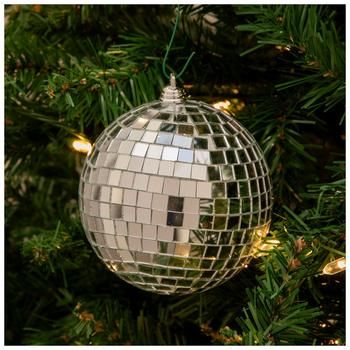 a mirror ball ornament hanging from a christmas tree