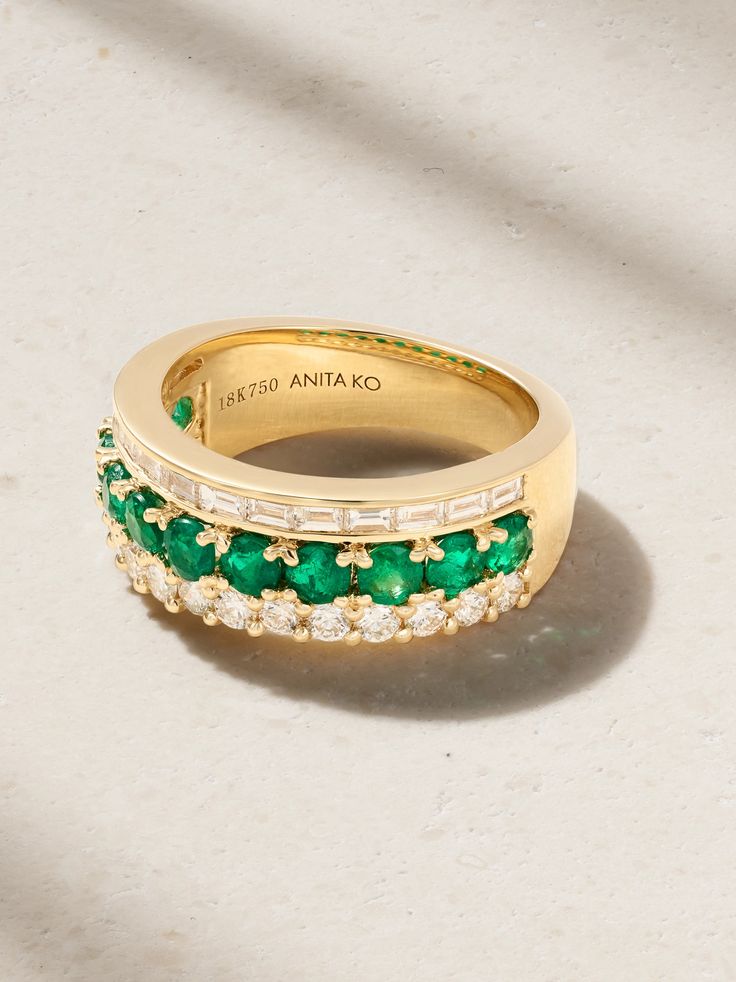 Anita Ko's ring is set with a row of emeralds sandwiched between baguette- and round-cut diamonds - it creates a cool stacked look without any effort. It's cast from 18-karat gold and looks especially chic against a bold red manicure. Emerald Ring With Baguette Diamonds Fine Jewelry, Emerald Ring With Baguette Diamonds In Fine Jewelry Style, Timeless Green Jewelry With Baguette Diamonds, Luxury Channel Set Emerald Ring For Anniversary, Luxury Green Channel Set Rings, Luxury Emerald Rings Channel Set, Luxury Emerald Rings With Channel Set, Luxury Emerald Ring With Diamond Channel Set, Luxury Emerald Diamond Ring With Channel Set