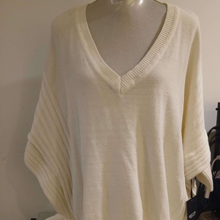 Color: Off White Size: L/Xl Brand: Simply Vera Verawang Material: 60% Cotton And 40% Acrylic Casual Cream Batwing Sleeve Tops, Casual White Knit Poncho, White Cozy Batwing Sleeve Tops, White Batwing Sleeve Cozy Top, Cozy White Batwing Sleeve Tops, Casual White Cotton Poncho, Casual Oversized Cream Poncho, White Batwing Sleeve Top For Winter, Casual White Poncho For Fall